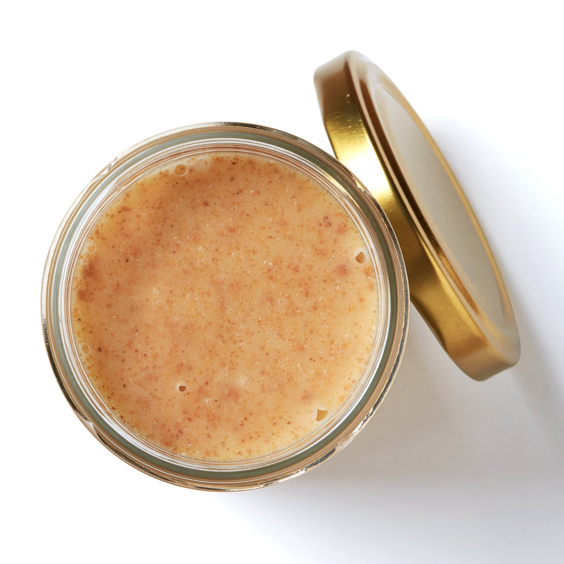Organic Raw Honey with Pure Propolis in an open jar, top view – Earthbreath