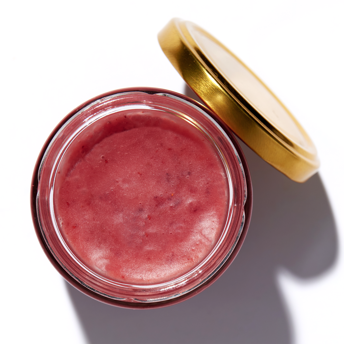Raw Honey with Lingonberries in an open jar, top view – Earthbreath