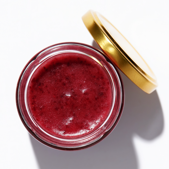 Open jar of honey with cranberries, top view