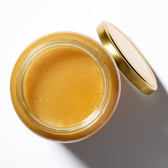 Organic Raw Forest Flower Honey in an open jar, top view – Earthbreath