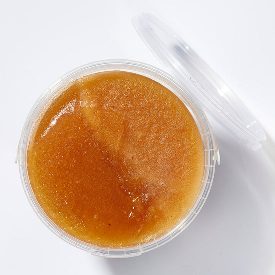 Open tub of Organic Raw Creamed Heather Honey, top view – Earthbreath