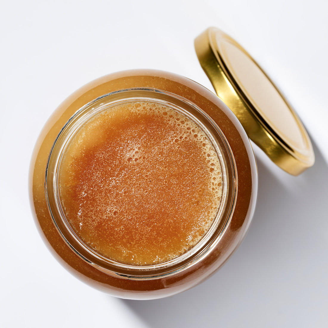 Organic Raw Creamed Heather Honey in an open jar, top view – Earthbreath