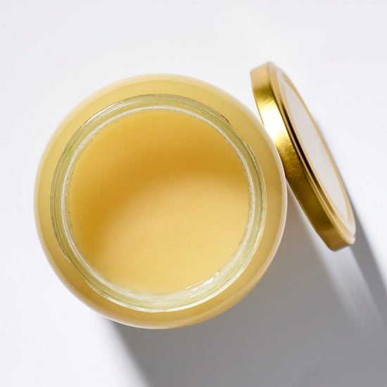 Organic Raw Spring Flower Honey in an open jar, top view – Earthbreath